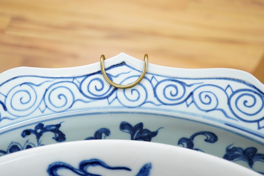 Two large Chinese blue and white chargers, largest 62cm diameter. Condition - good
